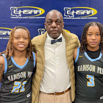 No. 5 Madison Prep coach Dwayne Hayes flanked by Auri Ray (left) and Brooklyn Smith (right) after the Chargers knocked off No. 1 University in the Division II select semifinals.