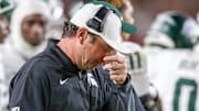 Michigan State head coach Jonathan Smith looks downward during the Spartans' game against USC on Sept. 20, 2025.