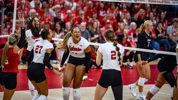 Freshman Manaia Ogbechie (14) had five blocks and eight kills in her first start. 