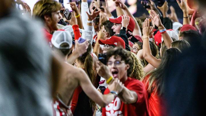 Husker fans storm the field to celebrate the win over Colorado.