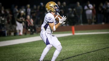 Norwalk's Eli Robbins returns the ball on Friday, Sept. 15, 2023, at Tiger Stadium in Adel.
