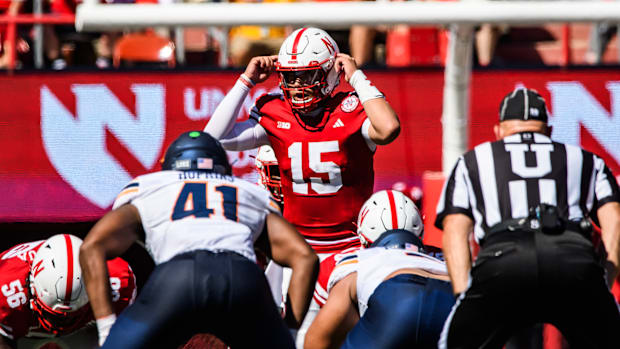 Nebraska quarterback Dylan Raiola (15) makes adjustments at the line against UTEP.