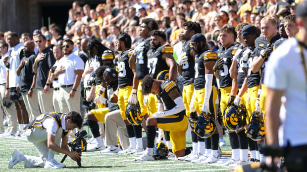 Iowa Football sideline during national anthem (Photo: Rob Howe/HN) 