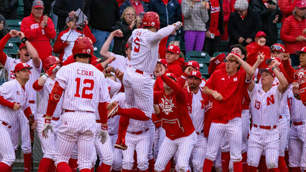 The Huskers celebrate Josh Caron's game-tying solo home run in the fourth inning. 