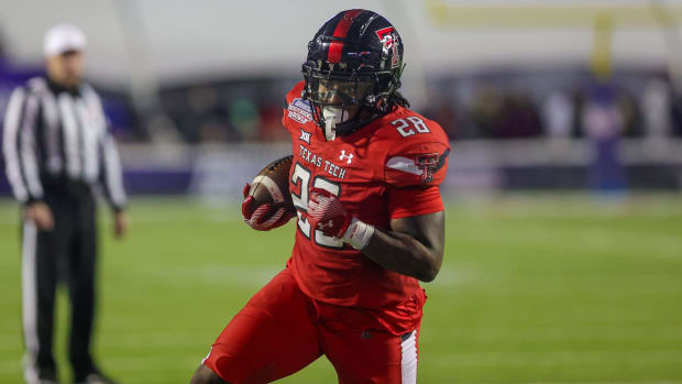 Texas Tech Red Raiders running back Tahj Brooks scores a touchdown in a college football game in the Big 12.