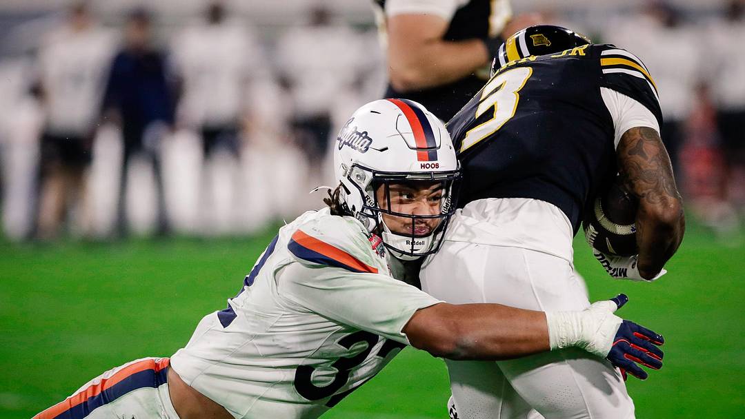 Dec 27, 2025; Jacksonville, FL, USA; Virginia Cavaliers linebacker Landon Danley (32) makes a tackle against the Missouri Tigers during the third quarter at EverBank Stadium. Mandatory Credit: Travis Register-Imagn Images