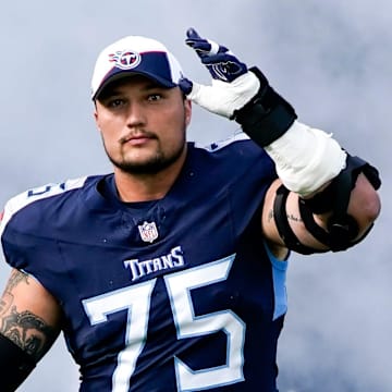 Tennessee Titans offensive tackle Dillon Radunz (75) heads to the field before a game against the Indianapolis Colts at Nissan Stadium in Nashville, Tenn., Sunday, Dec. 3, 2023.