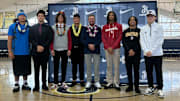 St. John Bosco football players pose for a photo with head coach Jason Negro (center) after Signing Day Wednesday morning on campus.