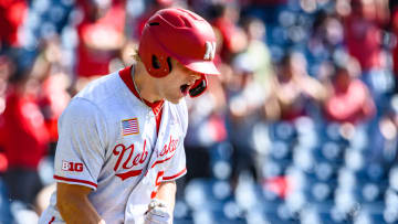 Josh Caron celebrates a three-run homer to get the Huskers on the board in the third inning. 