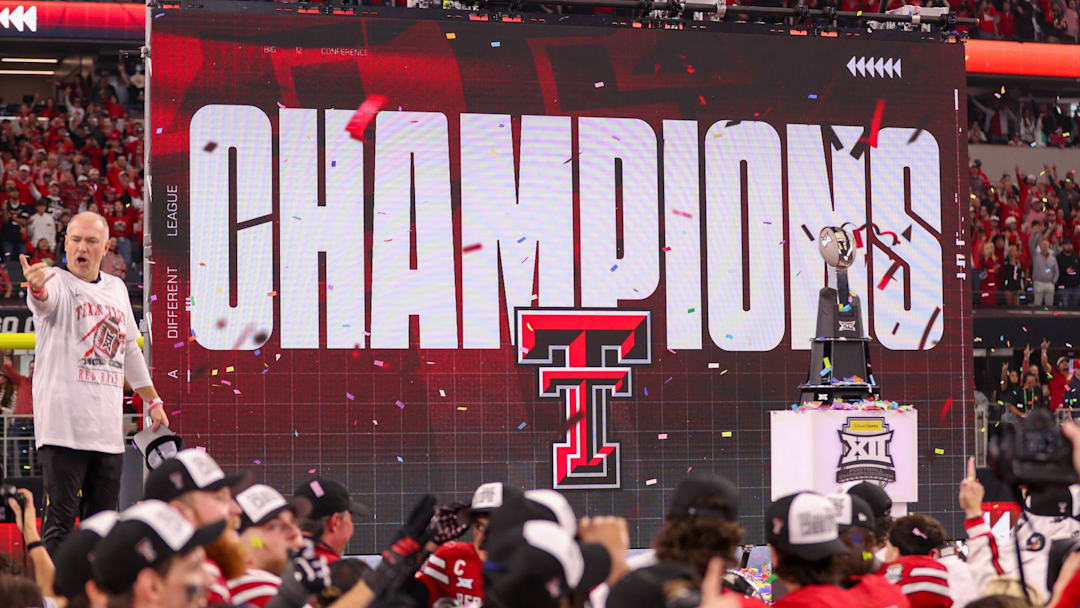 Texas Tech head coach Joey McGuire stands on stage after the Red Raiders defeated BYU 34-7 in the Big 12 Championship football game, Saturday, Nov. 6, 2025, at AT&T Stadium in Arlington.