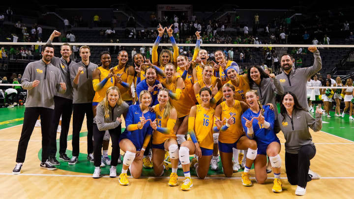 Pitt Volleyball celebrates a win over No. 10 Oregon on the road. 