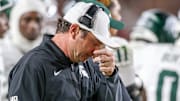 Michigan State head coach Jonathan Smith looks downward during the Spartans' game against USC on Sept. 20, 2025.