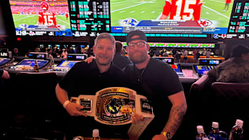 Winners of the Fantasy Football World Championships take their title belt to the sports book at Circa Resort and Casino in Las Vegas. 