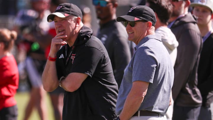 Texas Tech director of athletics Kirby Hocutt and head coach Joey McGuire look on during spring football practice, Thursday, April 2, 2026, at the Womble Football Center.