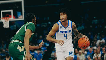 Memphis Tigers’ PJ Haggerty (4) brings the ball up the court against South Florida’s Kobe Knox (4) during a game on Friday, March 7, 2025 at the FedEx Forum in Memphis, Tenn.