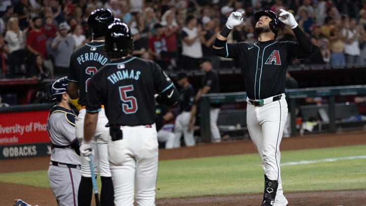 Arizona Diamondbacks third base Eugenio Suarez (28) crosses home plate after hitting a two-run home run on July 10, 2024 at Chase Field in Phoenix.