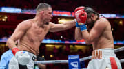 Nate Diaz throws a punch, as Jorge Masvidal covers up during their boxing match.