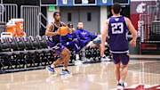 Wesley Yates III and JJ Mandaquit go through pregame preparations at WSU.