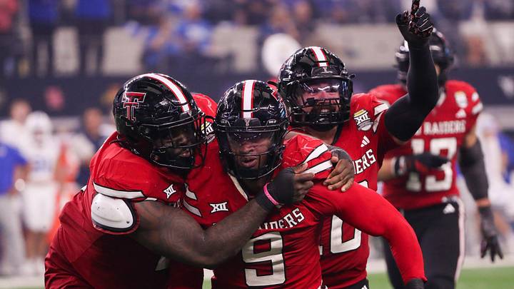 Texas Tech players Lee Hunter (left) and Jacob Rodriguez (back) celebrate Romello Height's fumble recover against BYU during the Big 12 Conference championship football game, Saturday, Nov. 6, 2025, at AT&T Stadium in Arlington.