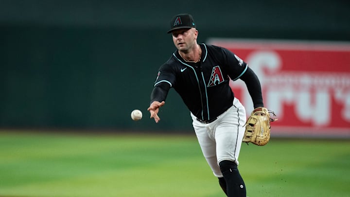 Arizona Diamondbacks first baseman Christian Walker (53) tosses the ball to first after fielding a sharp ground ball on July 27, 2024 at Chase Field in Phoenix.