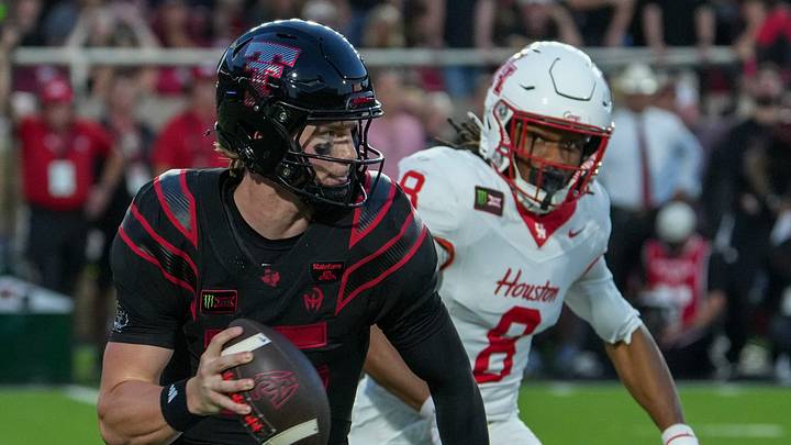 Texas Tech's Will Hammond rolls out for the pass against Houston during a Big 12 Conference football game, Friday, Sept. 18, 2026, at Galaxy Stadium.