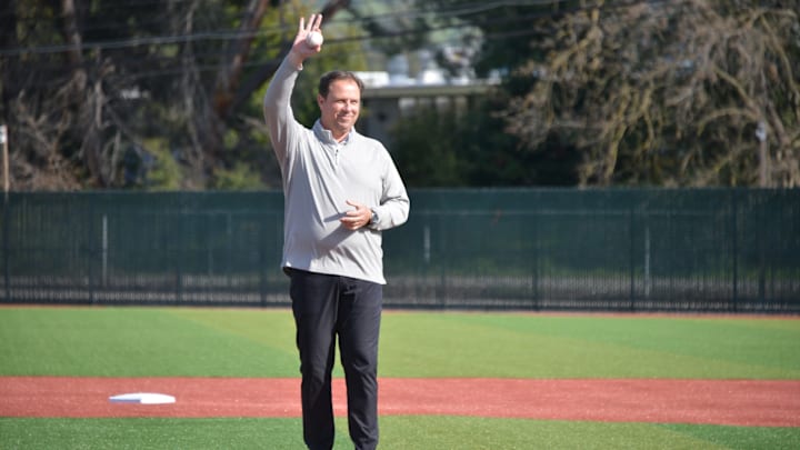 Kent Mercer throws out a first pitch in a baseball game last spring to honor his final year of service at De La Salle. On Saturday, Mercer was inducted to the De La Salle Hall of Fame