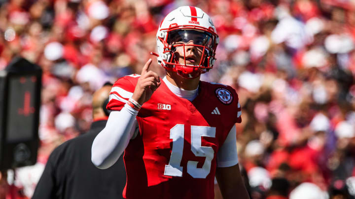 Dylan Raiola walks onto the field as Nebraska's starting quarterback for the first time.