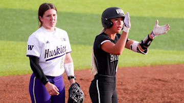 Mississippi State's Kylee Edwards (right) reacts to a hit against Washington during a game in the Lubbock Regional of the 2025 NCAA softball tournament, Friday, May 16, 2025, at Rocky Johnson Field.