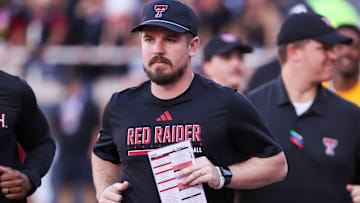 Texas Tech offensive coordinator Mack Leftwich jogs onto the field before a Big 12 Conference football game, Saturday, Nov. 15, 2025, at Jones AT&T Stadium.