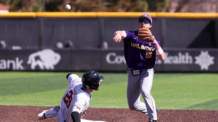 UAlbany's Cooper Loyal attempts to turn a double play against Texas Tech during a non-conference baseball game, Sunday, Feb. 22, 2026, at Rip Griffin Park.