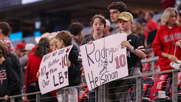Texas Tech fans hold signs supporting Jacob Rodriguez during the Big 12 Conference championship football game.