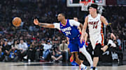 Jan 1, 2024; Los Angeles, California, USA; Los Angeles Clippers guard Norman Powell (24) passes the ball against Miami Heat guard Tyler Herro (14) during the first quarter at Crypto.com Arena. Mandatory Credit: Jonathan Hui-Imagn Images