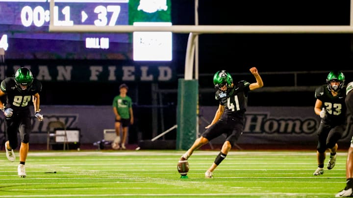 Lutheran South (Texas) kicker Rhet Lavergne hits the squib that won the game for the Pioneers against John Cooper.