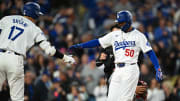 Mar 29, 2024; Los Angeles, California, USA; Los Angeles Dodgers second baseman Mookie Betts (50) celebrates with teammate Shohei Ohtani.