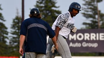 Duluth Husky Brylan West high-fives his third base coach after hitting a solo home run Tuesday against the St. Cloud Rox at Joe Faber Field. Duluth lost 9-1 as West had two of the Huskies' three hits. The sophomore at Florida International has hit two home runs this summer.