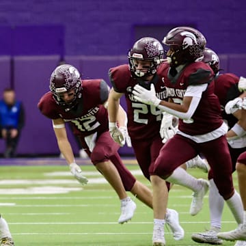 Savion Miller and Iowa City Regina topped Grundy Center in the Class 1A Iowa high school football semifinals.