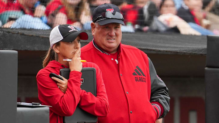 Texas Tech coaches Gerry Glasco (right) and Tara Archibald watch from the dugout during a Big 12 Conference softball game, Friday, May 1, 2026, at Tracy Sellers Field.