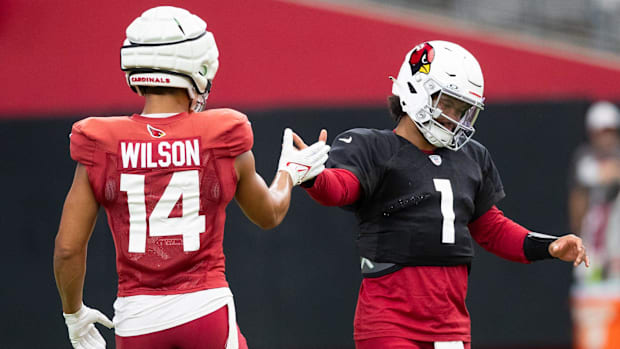 Arizona Cardinals wide receiver Michael Wilson (14) daps up Arizona Cardinals quarterback Kyler Murray (1) at training camp 