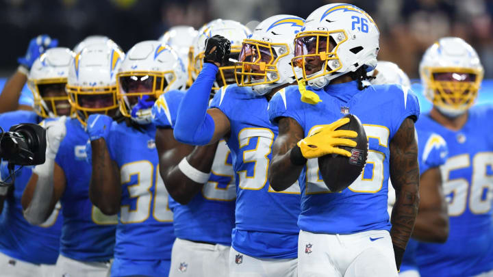 Oct 29, 2023; Inglewood, California, USA; Los Angeles Chargers cornerback Asante Samuel Jr. (26) celebrates with other teammates after Chicago Bears failed attempt on fourth down during third quarter at SoFi Stadium. Mandatory Credit: Jonathan Hui-USA TODAY Sports