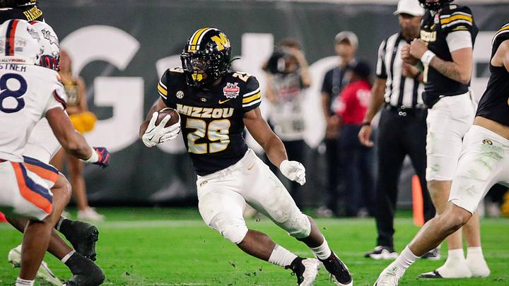 Dec 27, 2025; Jacksonville, FL, USA; Missouri Tigers running back Ahmad Hardy (29) runs the ball against the Virginia Cavaliers during the second quarter at EverBank Stadium. Mandatory Credit: Travis Register-Imagn Images