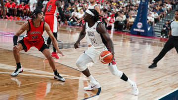 Indiana Pacers guard Andrew Nembhard of Team Canada defends Boston Celtics guard Jrue Holiday of Team USA during the USA Basketball Showcase in Las Vegas on July 10, 2024. (Mandatory Photo Credit: USA Basketball/Alex Shigio)