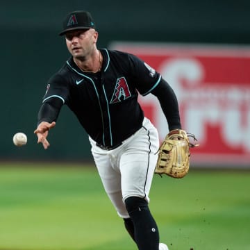 Arizona Diamondbacks first baseman Christian Walker (53) tosses the ball to first after fielding a sharp ground ball on July 27, 2024 at Chase Field in Phoenix.