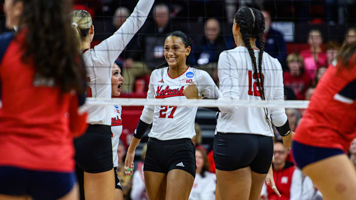 Harper Murray (27) smiles after an ace serve. She served three in a row in the second set and had four total. Harper Murray (27) smiles after an ace serve. She served three in a row in the second set and had four total.