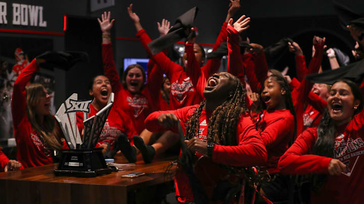 Texas Tech players celebrate their revealed seed during the NCAA softball tournament selection show watch party, Sunday, May 11, 2025, in the south end zone building of Jones AT&T Stadium.