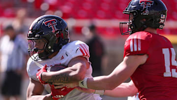 Texas Tech's Quinten Joyner takes the handoff from Will Hammond during spring football practice, Tuesday, April 15, 2025, at Jones AT&T Stadium.