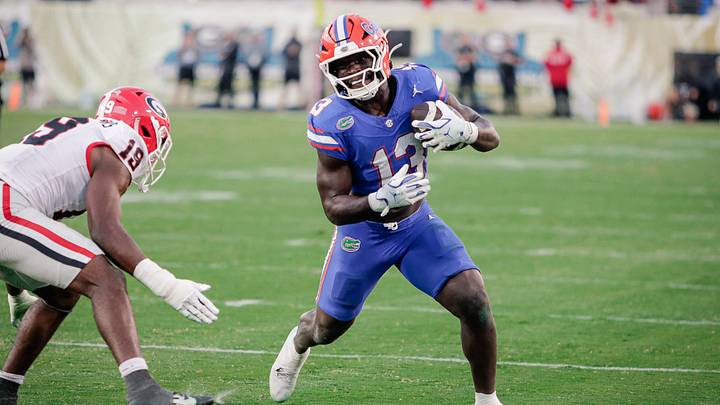 Nov 1, 2025; Jacksonville, Florida, USA; Florida Gators running back Jadan Baugh (13) runs with the ball against the Georgia Bulldogs at EverBank Stadium. Mandatory Credit: Travis Register-Imagn Images