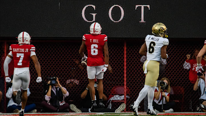 Tommi Hill (6) celebrates in the end zone after his pick-six. 