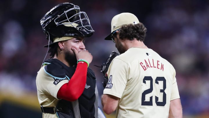 Arizona Diamondbacks pitcher Zac Gallen (23) meets on the mound with catcher Jose Herrera (11) on Aug. 30, 2024 at Chase Field in Phoenix.