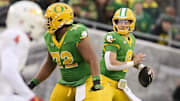 Nov 9, 2024; Eugene, Oregon, USA; Oregon Ducks quarterback Dillon Gabriel (8) throws a pass during the first half against the Maryland Terrapins at Autzen Stadium. Mandatory Credit: Troy Wayrynen-Imagn Images