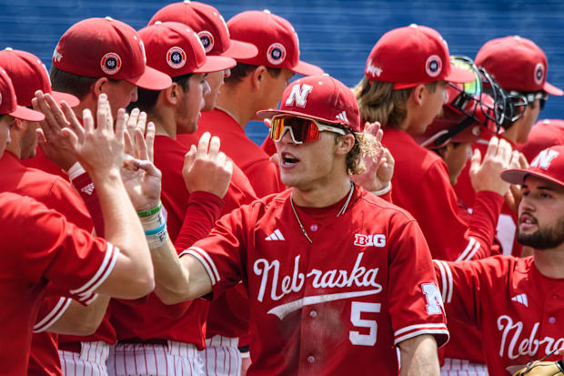 Robby Bolin (5) celebrates the win with his teammates. 